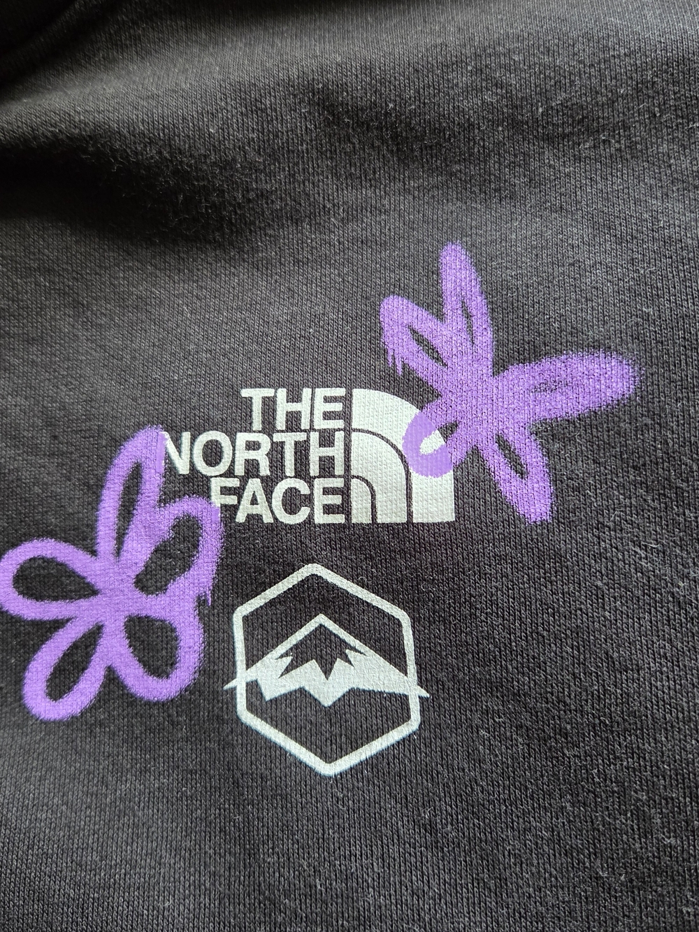 The North Face Black Tee with Purple Butterfly Graphics